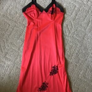Women’s vintage slip, red and black, size  32, brand is Movie Star